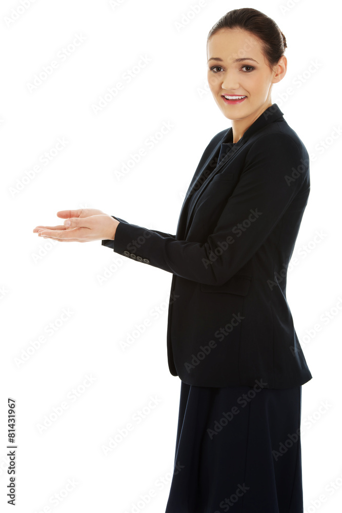 Young woman holding copy space in hands. Young woman holding copy space in hands.