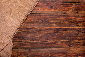 wooden table with burlap texture background
