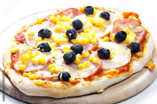 pizza with ham, corn and olives