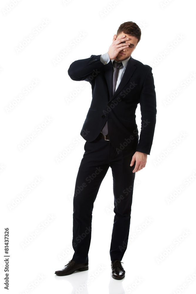 Worried businessman touching his forehead. Worried businessman touching his forehead.