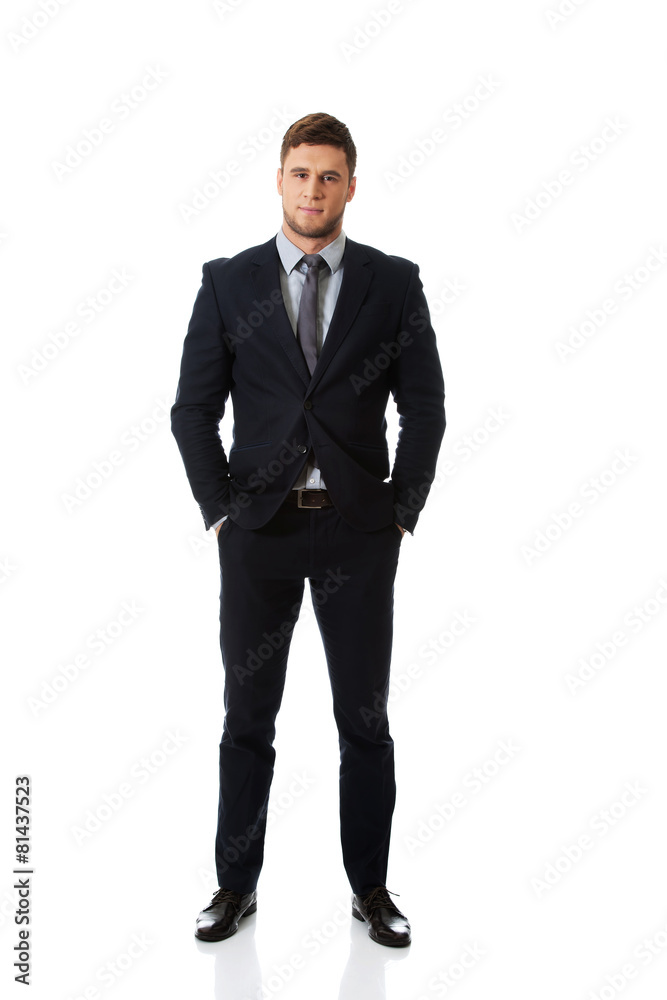 Successful businessman with hands in pockets. Successful businessman with hands in pockets.