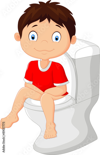 Little boy sitting on the toilet
