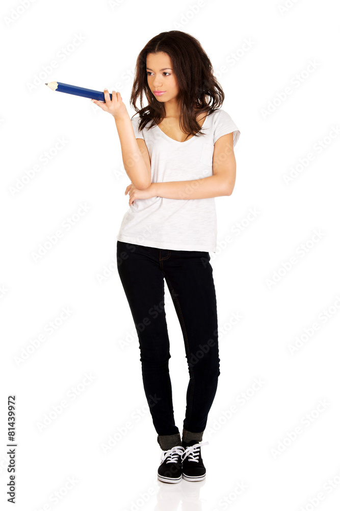 Woman pointing aside with big pencil. Woman pointing aside with big pencil.