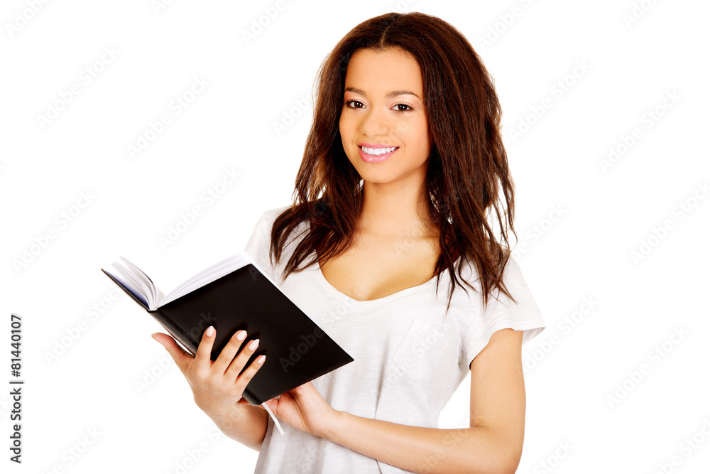 Young student woman with notebook. Young student woman with notebook.