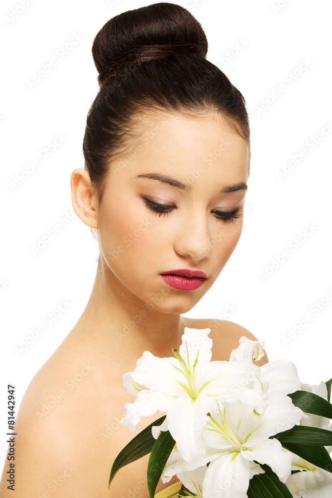 Beauty face of a woman with flower. Beauty face of a woman with flower.