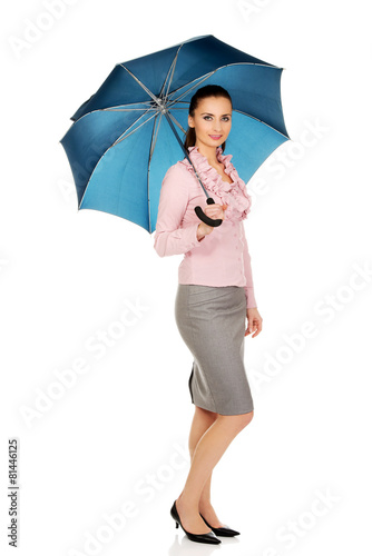 Business woman is holding blue umbrella.