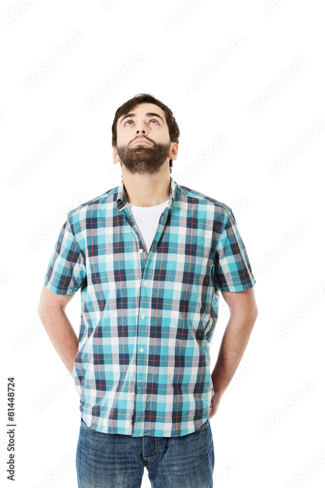 Young handsome man looking up. Young handsome man looking up.