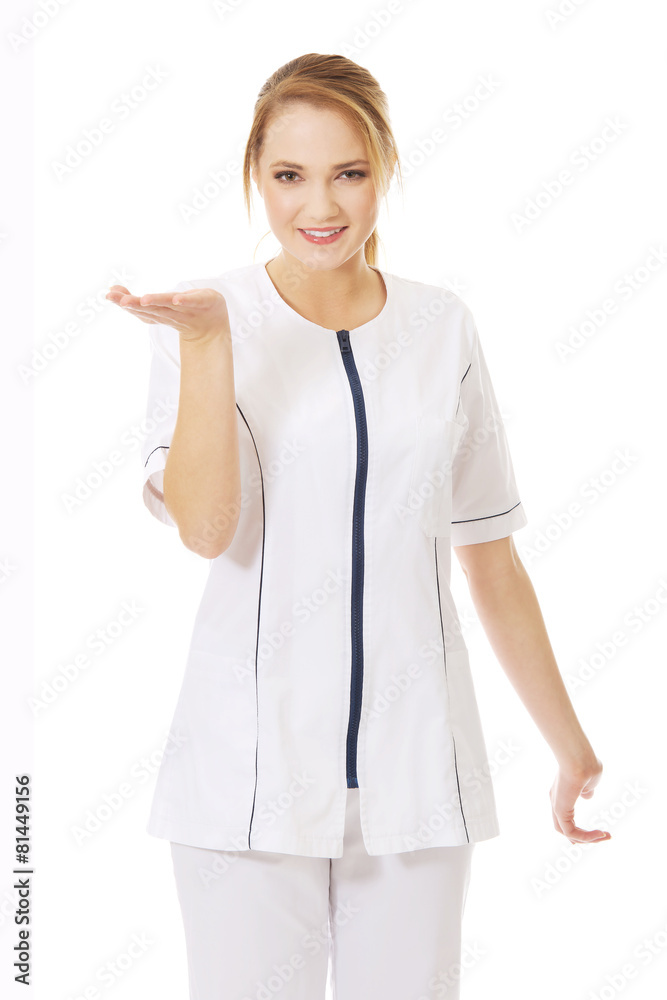Young female doctor holding an abstract space. Young female doctor holding an abstract space.