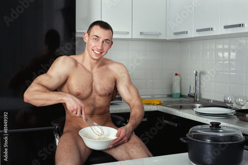 Photography Bodybuilder preparing in the kitchen.