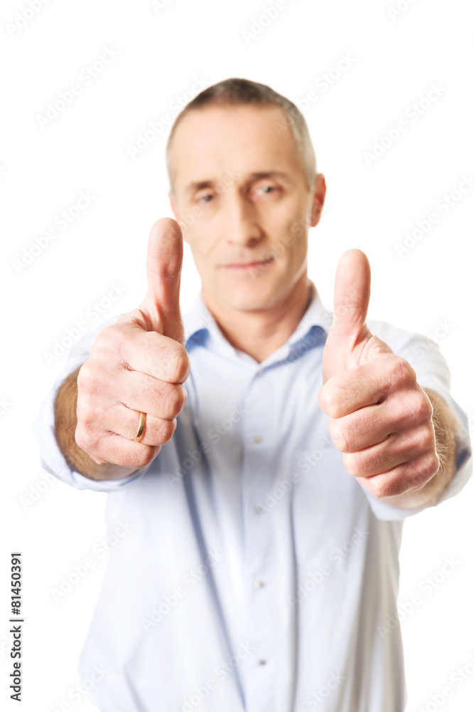 Mature man gesturing ok sign Mature man gesturing ok sign
