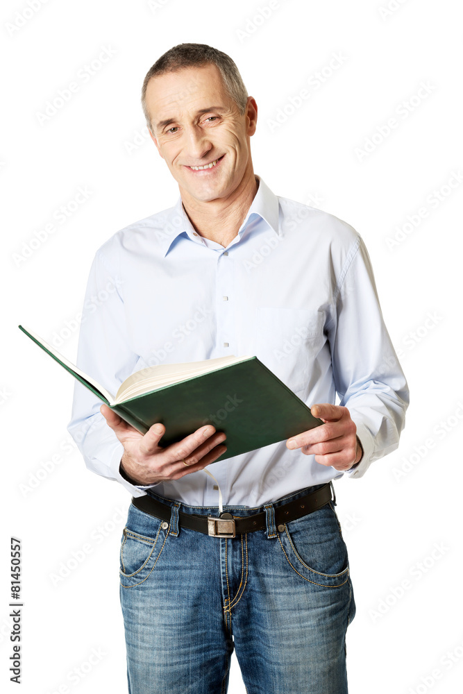 Handsome man reading his schedule Handsome man reading his schedule