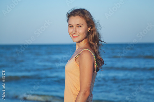 Young beautiful girl on the beach