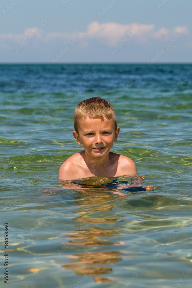 Young boy in the ocean