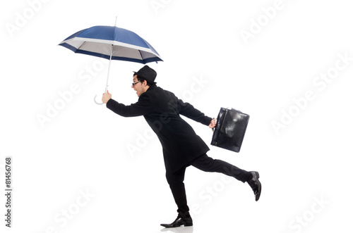 Young man holding suitcase and umbrella isolated on white