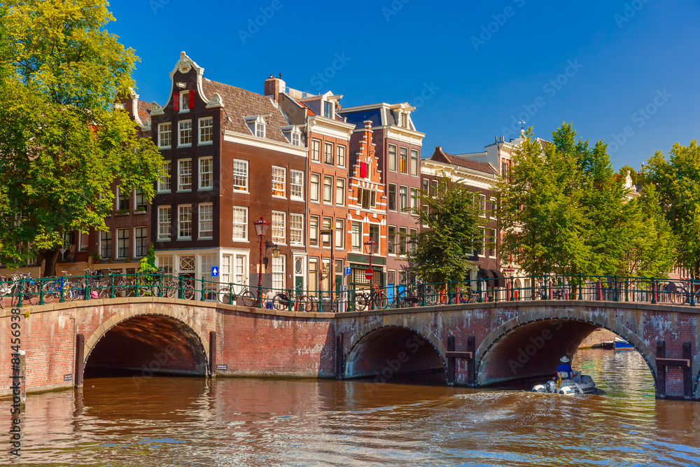 Fototapeta premium City view of Amsterdam canal, bridge and typical houses, Holland
