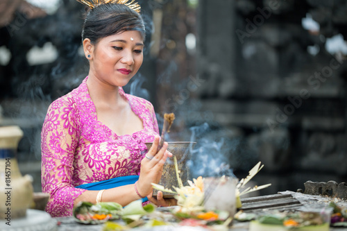 Balinese woman praying