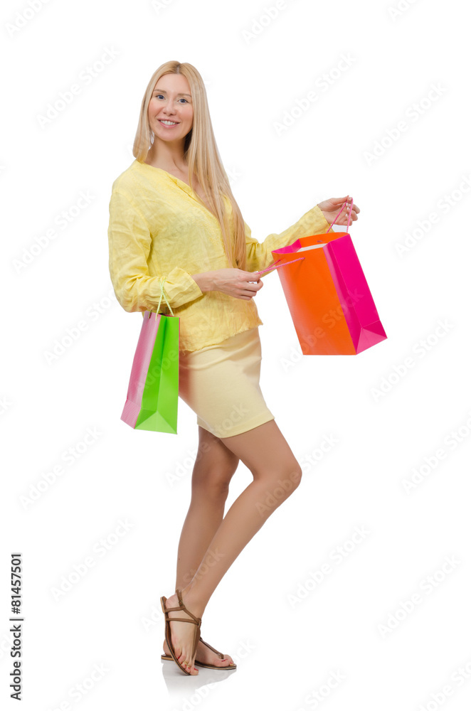 Pretty young woman in summer yellow clothing isolated on white