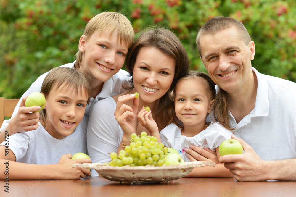  Family of five eating fruits 