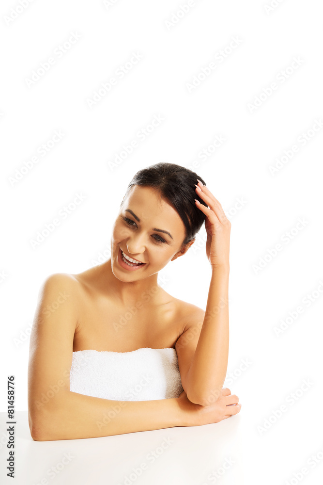 Spa woman with rolled towel on the desk Spa woman with rolled towel on the desk