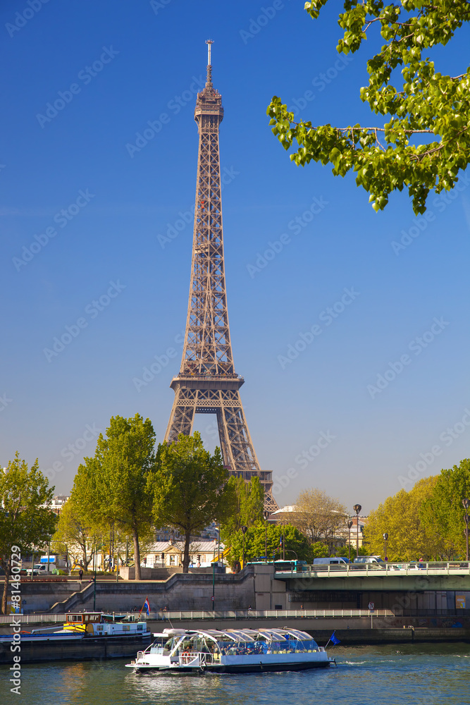 Obraz premium Eiffel Tower with boat on Seine in Paris, France