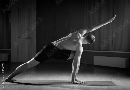 man doing yoga , black and white 4