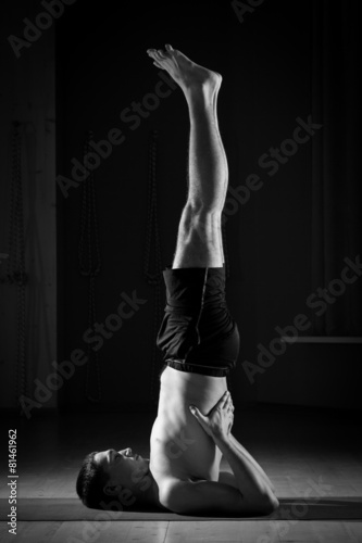 young man doing yoga in the gym, black and white 5
