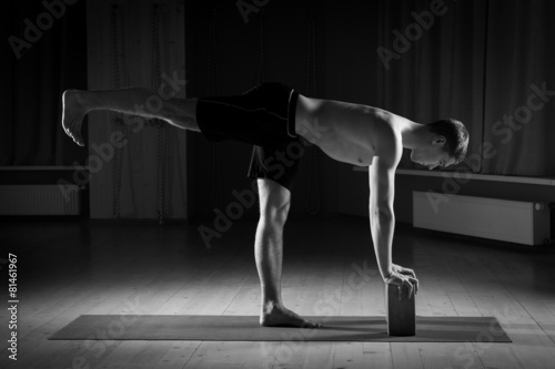 young man doing yoga in the gym, black and white 3 photo