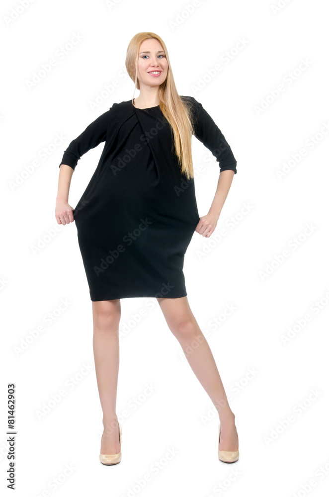 Fototapeta premium Pretty pregnant woman in mini black dress isolated on white