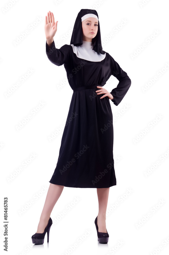 Young serious nun with sign stop isolated on white Young serious nun with sign stop isolated on white