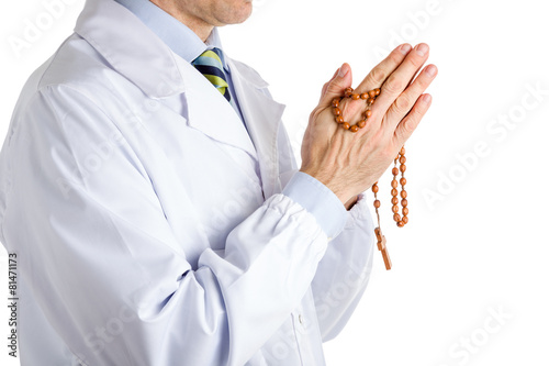 man in medical white coat holding wooden Rosary beads