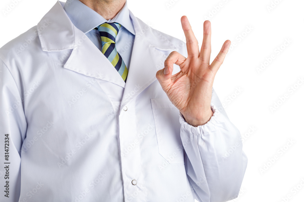 Man in medical coat making ok gesture