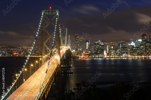 San Francisco Bay Bridge and skyline at night