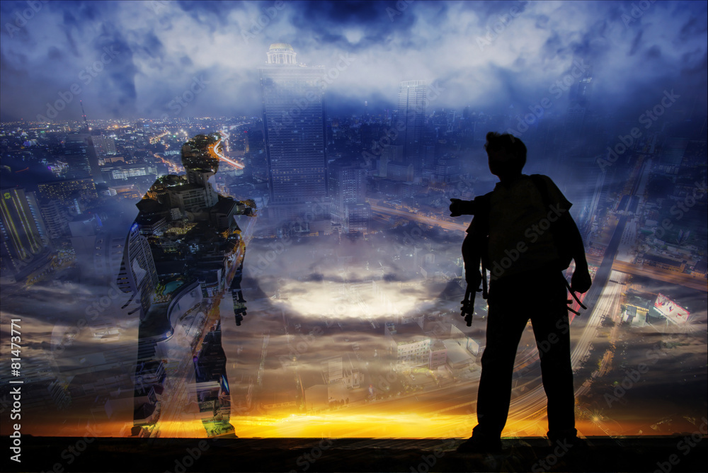 Double exposure of young man with sunset and night city.