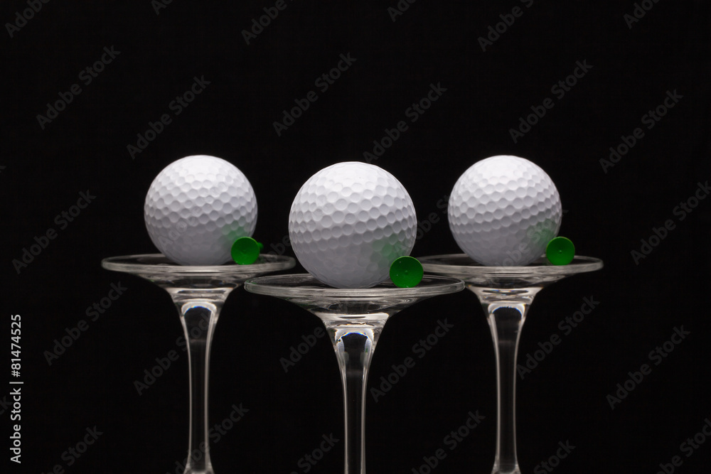 Three glasses of champagne and golf balls Three glasses of champagne and golf balls