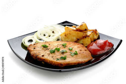 Photography Roasted steak with baked potatoes, onion and ketchup