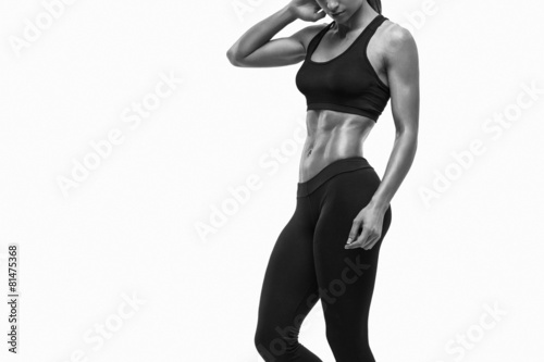 Obraz na plátně Fitness sporty woman showing her well trained body
