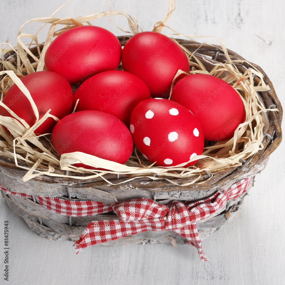 Red Easter eggs in basket
