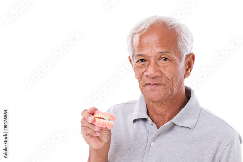 Konstfotografi old senior man with hand holding denture