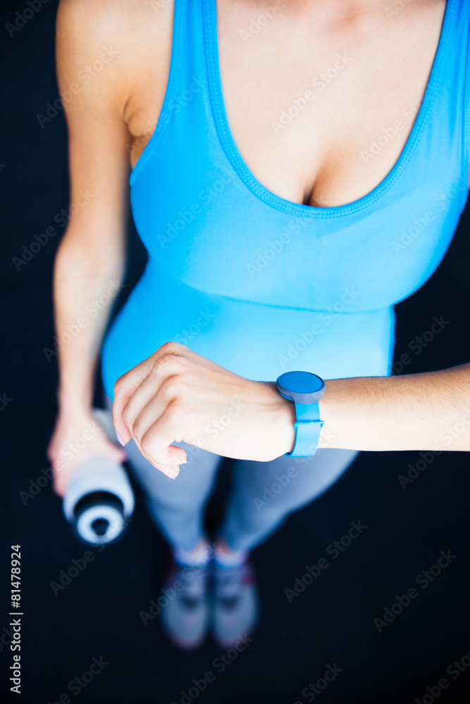 Closeup image of a woman with activity tracker