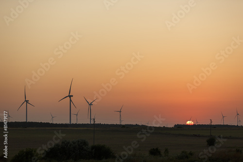 Windmills silhouettes at sunrise