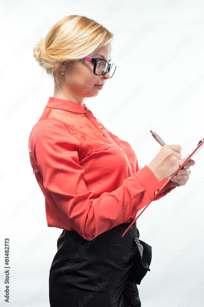 business woman in glasses writes on the tablet business woman in glasses writes on the tablet