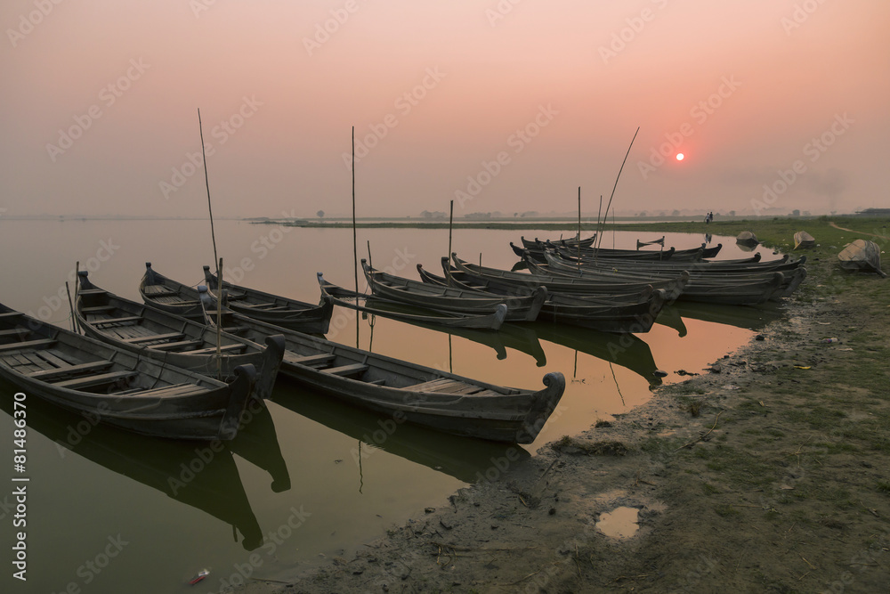 Wooden boats of fishermen at sunset