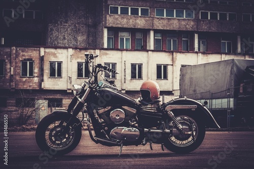 Custom made bobber motorcycle on a road photo