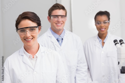 Scientists smiling and looking at camera