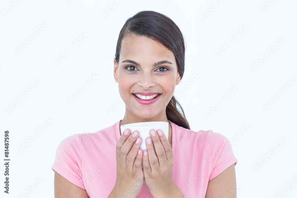 Pretty brunette drinking cup of coffee Pretty brunette drinking cup of coffee