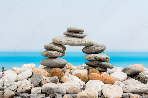 Door of stones on the beach