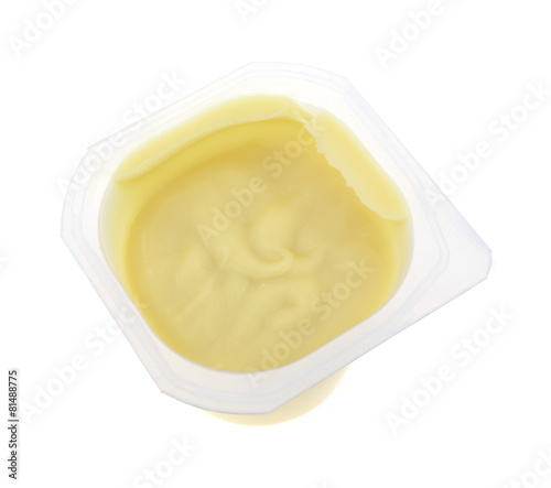 Vanilla pudding in a plastic container