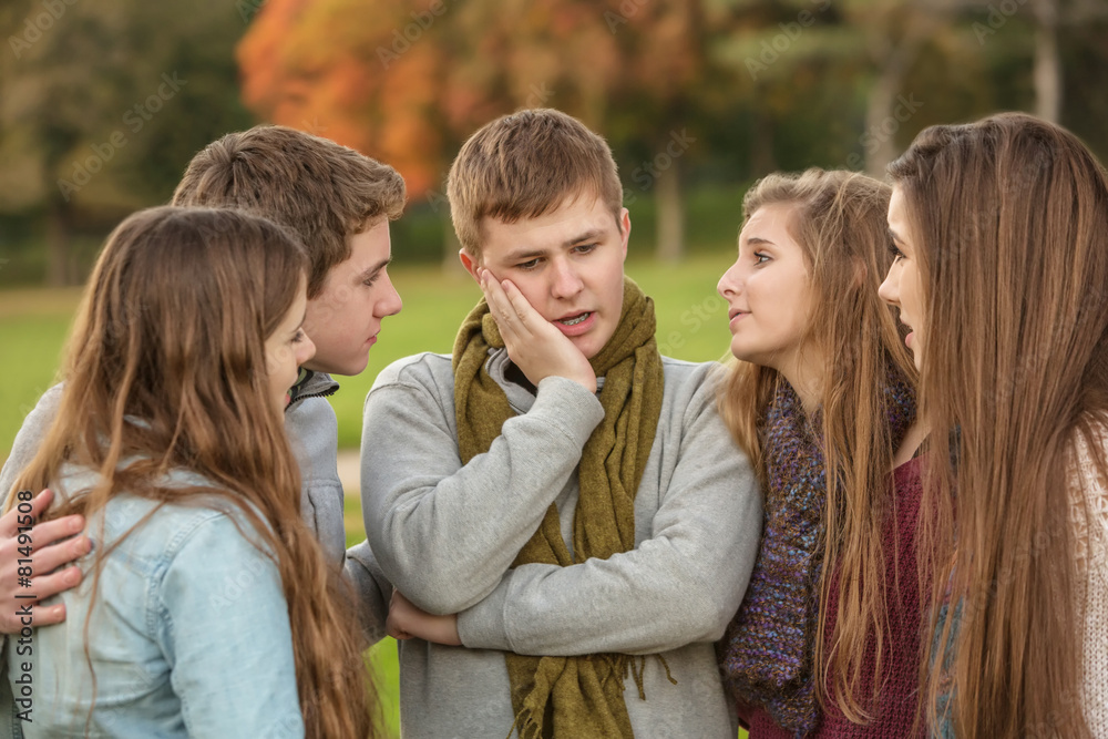 Fototapeta premium Perplexed Teen with Friends