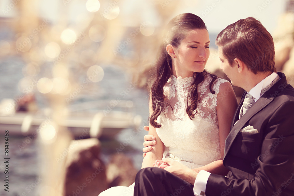 Bride and groom near ocean