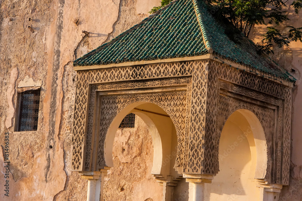 hood ornament on the walls of the medina of Meknes, Morocco